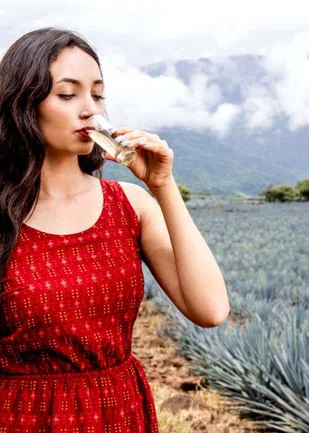 Girl drinking Tequila Drink